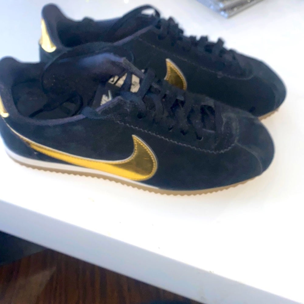 Black suede and gold Nike